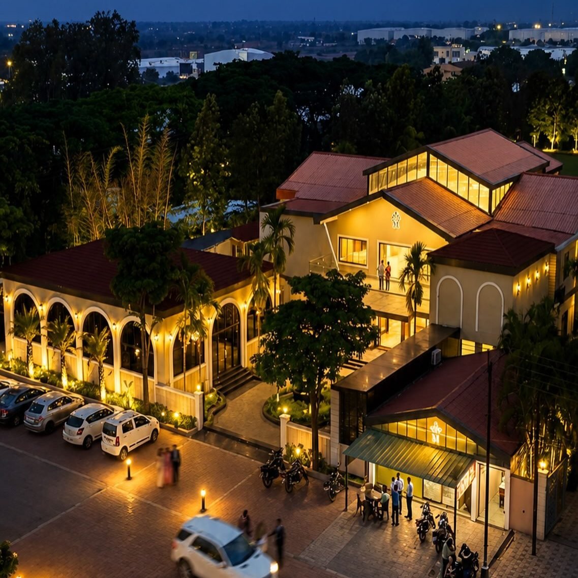 Meera Celebration lit up at dusk, seen from above